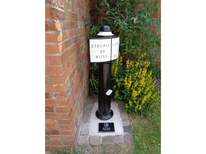 Milepost 28 with dedication plaque