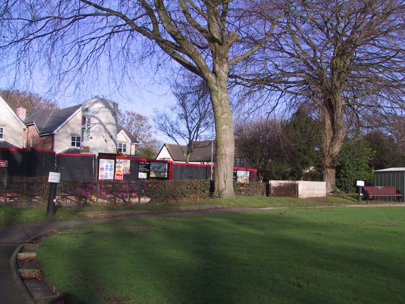 The two original mileposts at Denstone Bowling Club